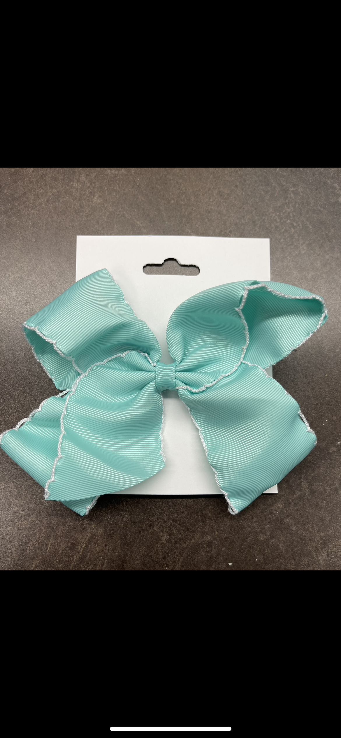 Teal and white bow